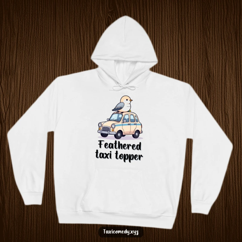 Funny hoodie showing a little bird perched on the rooftop of a miniature taxi, enjoying a cozy ride.